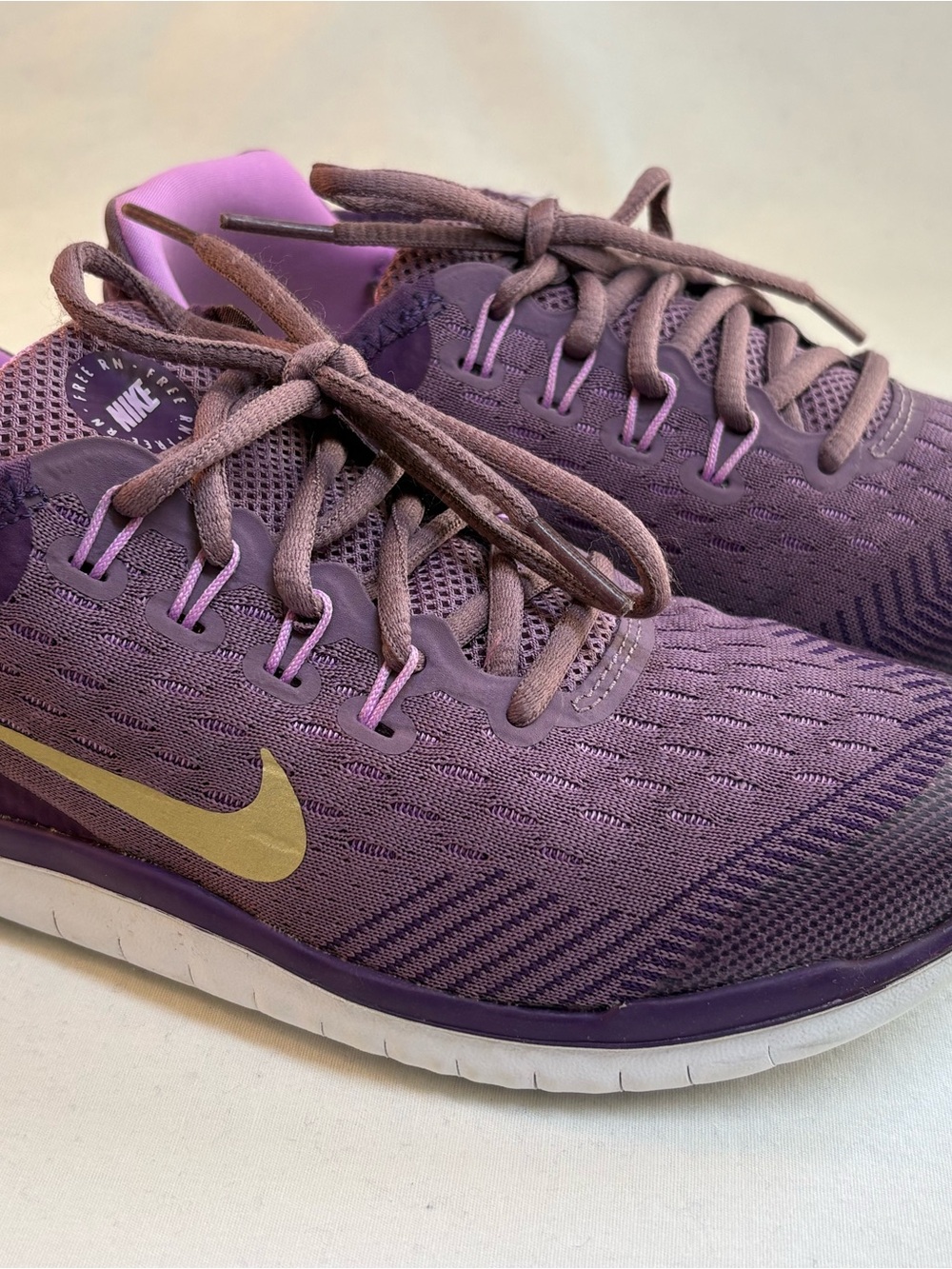 Nike Women's Purple Athletic Shoes with Gold Swoosh